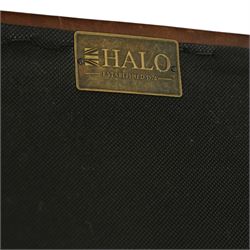 Timothy Oulton, Halo - Late 20th century brown leather Chesterfield settee, the upholstered frame with deep buttoning to back and arms, large scroll terminals with brass studwork, twin seat cushions, raised on castored legs