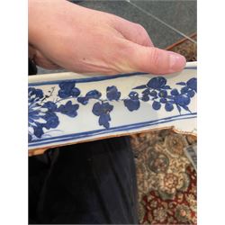 Chinese blue and white planter and stand, each of square slightly tapering and flared form, the planter decorated with two dragons and blossoming peonies, between stylised borders, the stand decorated with flower heads and vines, planter H30cm W29cm, stand H7cm D28.5cm