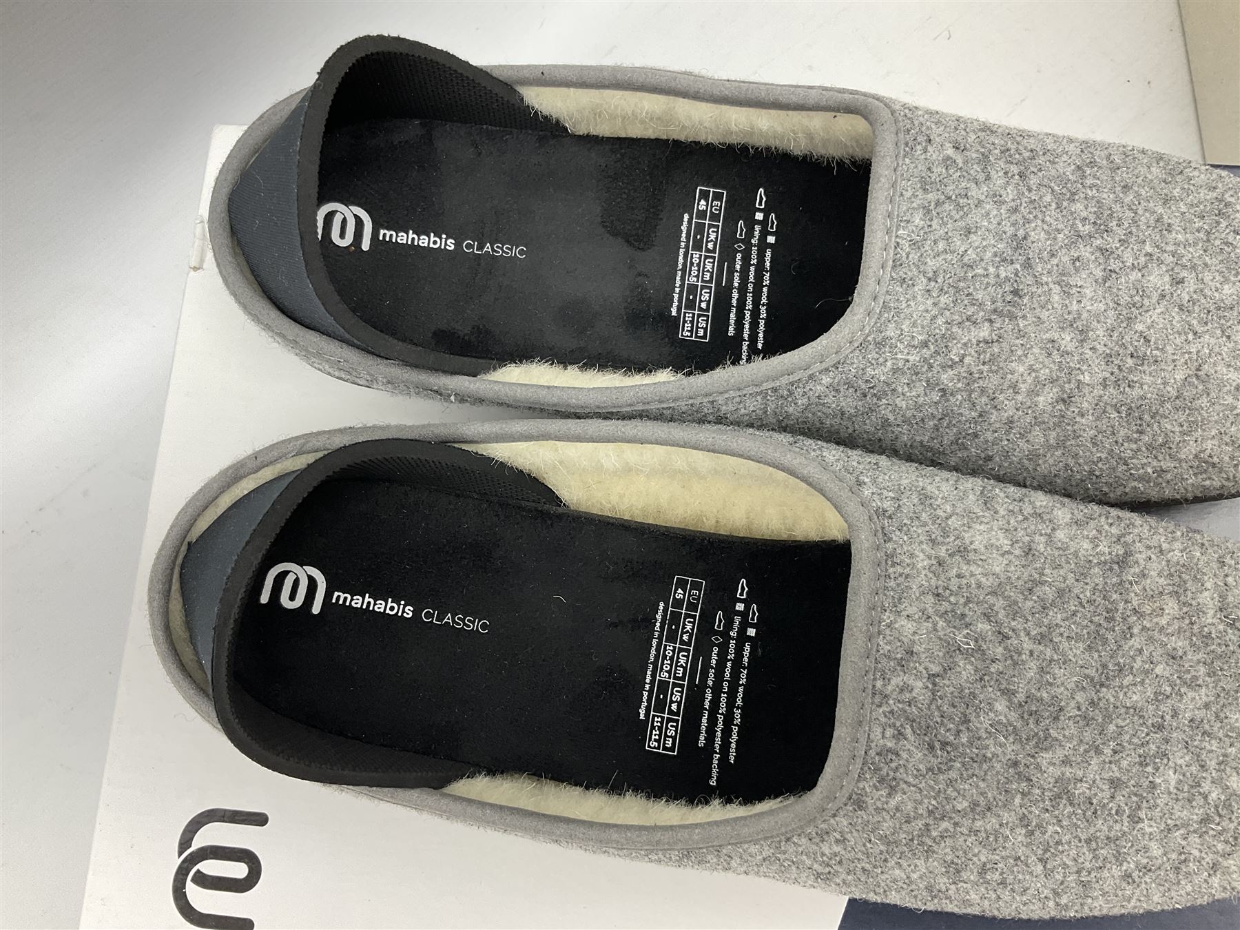 Two pairs of Mahabis slippers, comprising Mahabis curve grey and black slippers size EU42 and Mahabis classic grey and black slippers, both new in box
