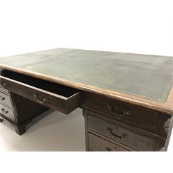 Large 20th century partners desk with dark green leather inset tooled top,  four short and two long drawers, two pedestal supports featuring three short drawers and two single cupboards