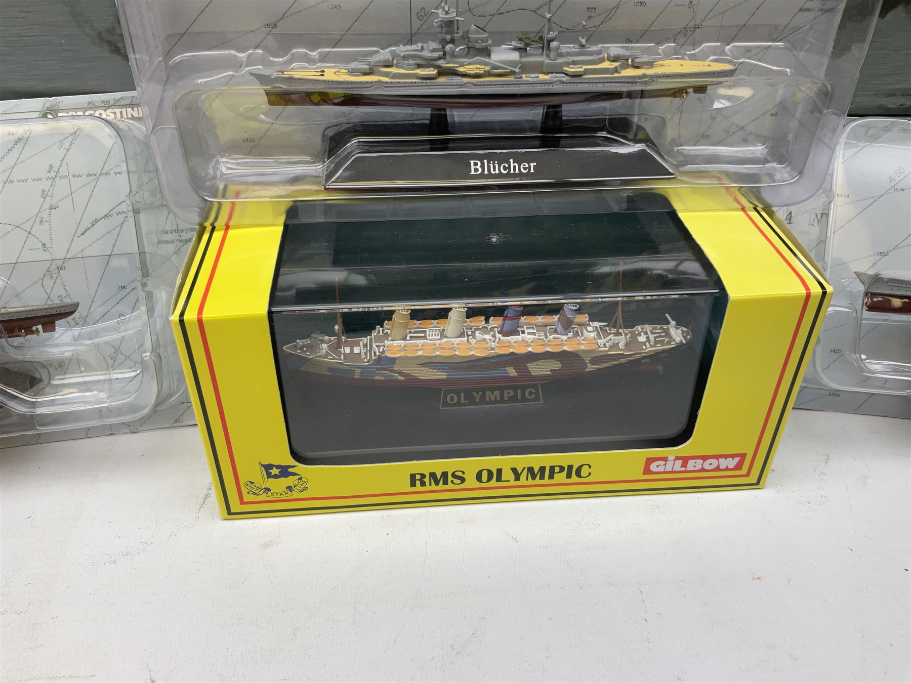 DeAgostini Atlas Editions - HMS Anson, HMS Exeter, HMS Renown, HMS Nelson, HMS Warspite, HMS Hood, Bismark, and USS Saratoga, all boxed; DeAgostini - Gneisenau, Blucher, and Prinz Eugen, packaged; together with ten further DeAgostini battleships, unboxed, and a Gilbow RMS Olympic model, boxed (qty)