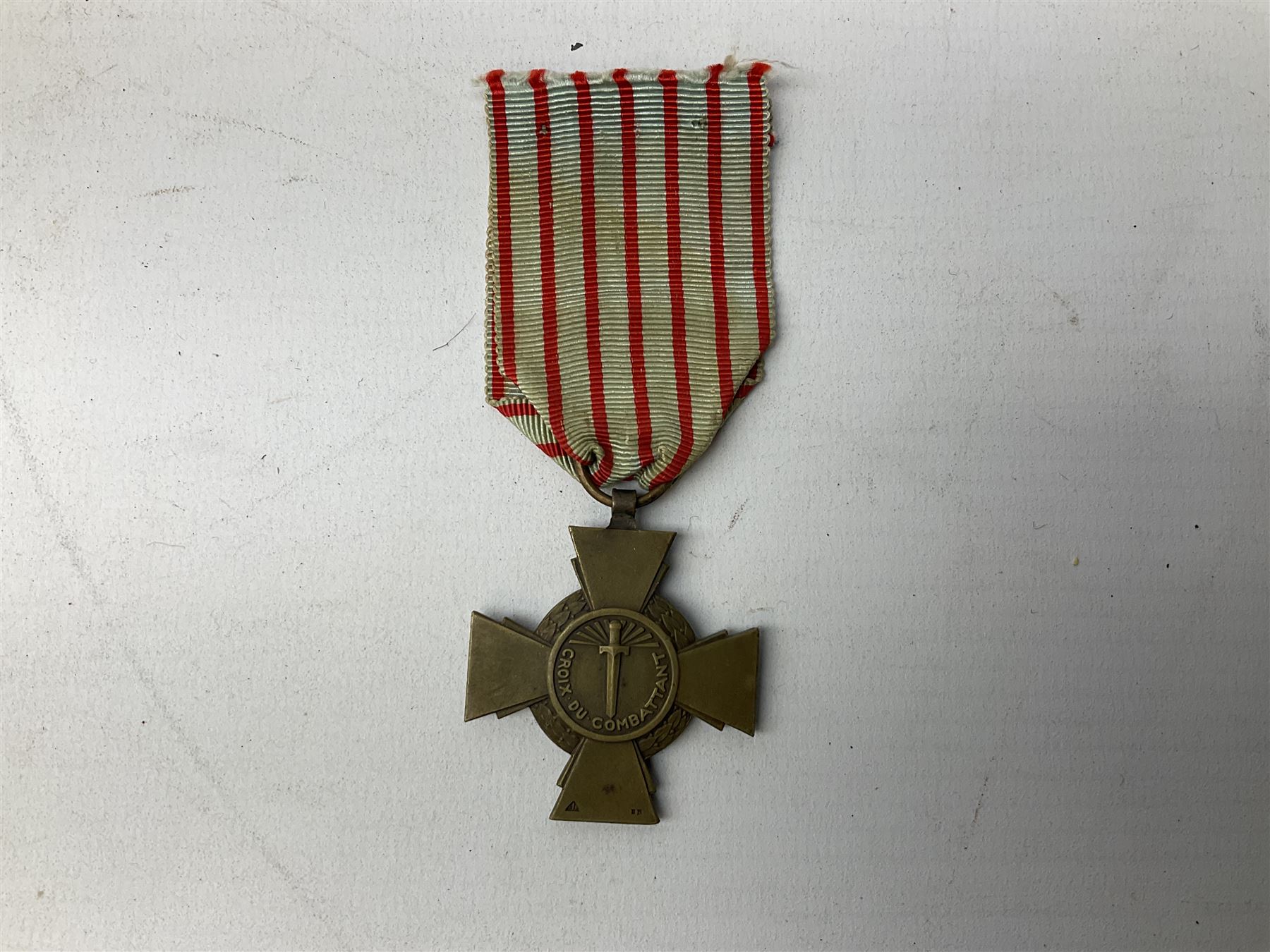 Five continental medals - WW1 Belgian Cross of Fire; WW1 French Croix De Guerre; French Croix De Combattant; French Republic Workers silver merit awarded to L. Mounet 1950; and boxed French Palmes Universitaires Officier d'Academie silver and enamel wreath (5)