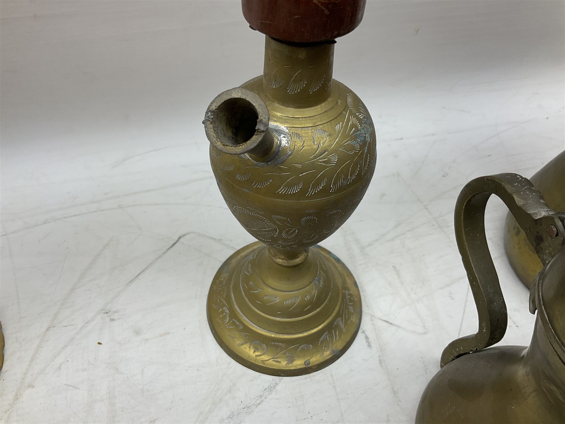 Two brass hookah pipes, and quantity of brass Arabic Dallah coffee pots and other brassware