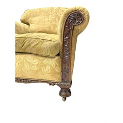 Early 20th century mahogany framed three-piece lounge suite - three-seat camelback sofa (W203cm, D105cm); pair of matching armchairs (W95cm, D96cm); upholstered in neutral foliate pattern fabric, carved with trailing leafy branches, ball and claw carved feet with brass castors 