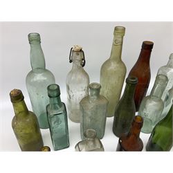 Collection of various vintage glass bottles and stoppers, including advertising bottles, sauce bottles and medical bottles etc
