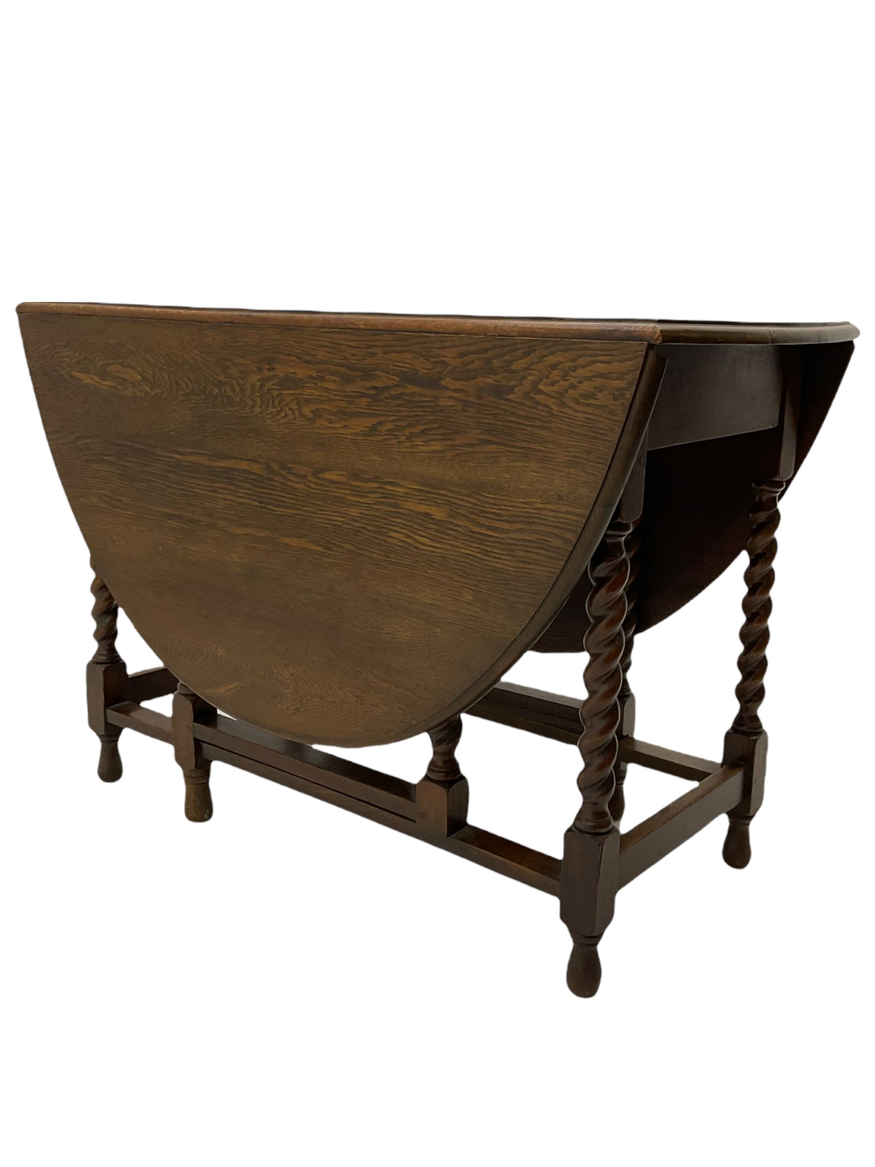 Early 20th century oak barley twist drop leaf dining table (105cm x 154cm, H74cm), and four chairs 