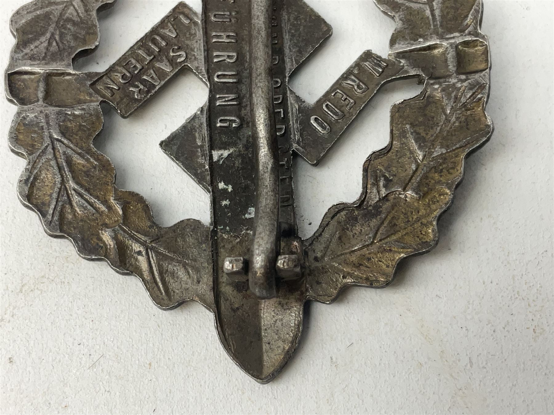 Two WW2 German Sports badges - SA sports badge marked verso 'W.Redo Eigentum D. Obersten SA. Fuhrung Saar Lautern'; and DRL sports badge marked verso 'Wernstein Jena D.R.G.M. 35269' (2)