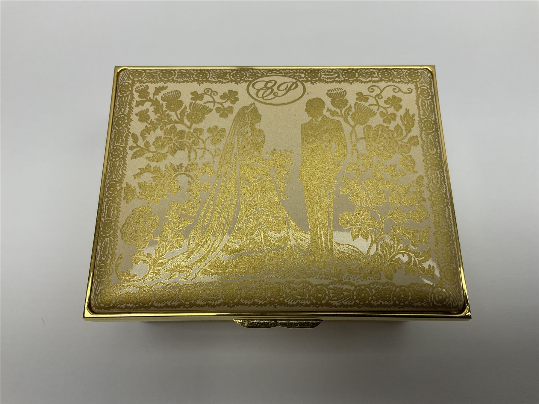 Two Halcyon Days enamel boxes, both of rectangular form, the first depicting Buckingham Palace, 'To Celebrate the Golden Jubilee of Her Majesty Queen Elizabeth', the second depicting the marriage of The Queen and Prince Philip, in celebration of their Diamond Wedding Anniversary, H4cm, W8.5cm, both boxed