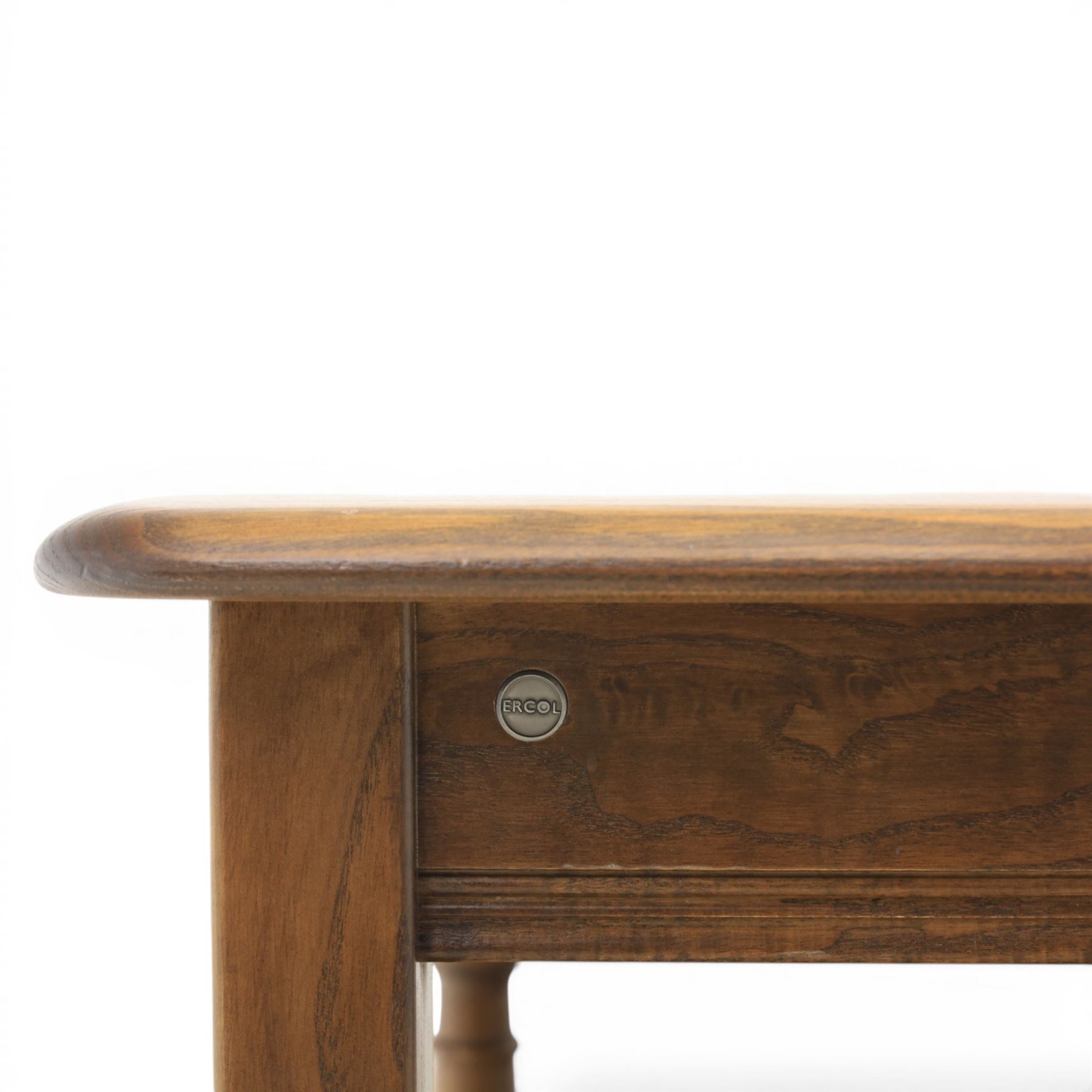 Ercol -  dark elm corner TV stand and coffee table, TV stand with drop triangular leaf, over open recess above a single drawer (H 47cm, D 44cm with leaf 79cm, W 73cm,  the coffee table with chamfered rectangular top with full length undertier, raised on turned supports (H 43cm, D 54cm, W 115cm) 