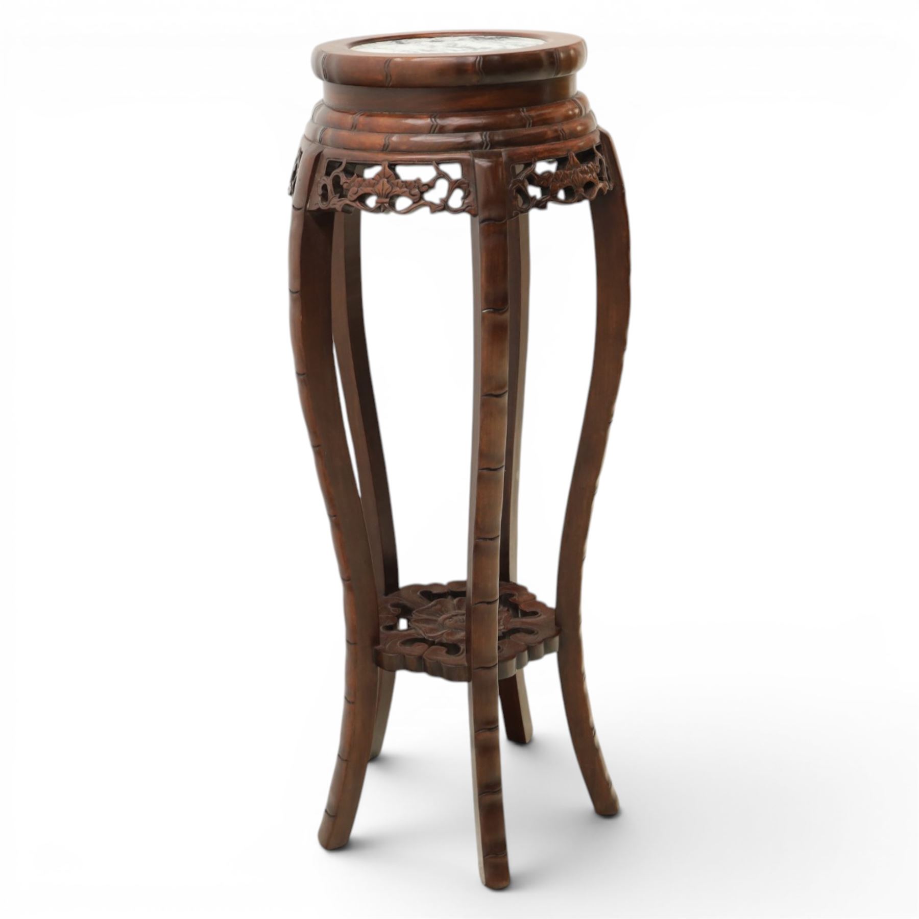 Chinese hardwood jardiniere stand, with inset black veined white marble, pierced carved apron united by rose carved undertier