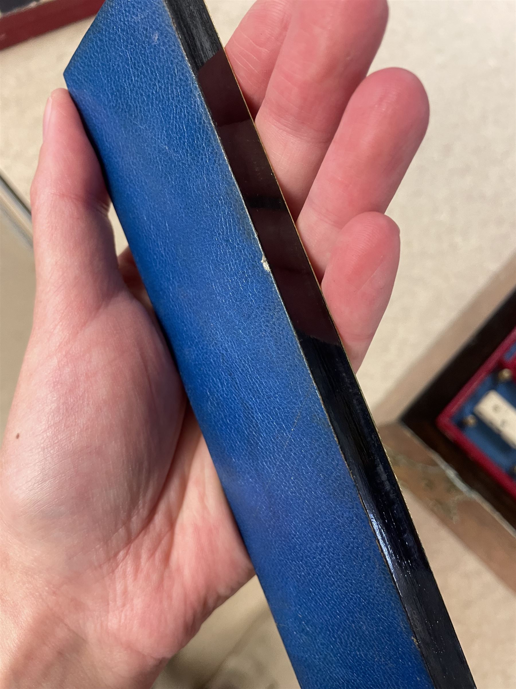 19th century walnut and brass bound games compendium box, painted to enhance the grain, of rectangular form, the hinged opening cover with rounded sides, central brass cartouche with engraved lion crest, and brass riveted straps, opening to reveal a red leather and blue silk lined compartmented interior, with fold-down games board, and lift-out tray containing playing cards, ebony turned dice towers, white and red stained bone draughts, and chess pieces, ivory dice, and ivory and ebony whist markers, and brass bezique board, cribbage board and markers, H15cm W32cm D24cm
This lot has been registered for sale under Section 10 of the APHA Ivory Act