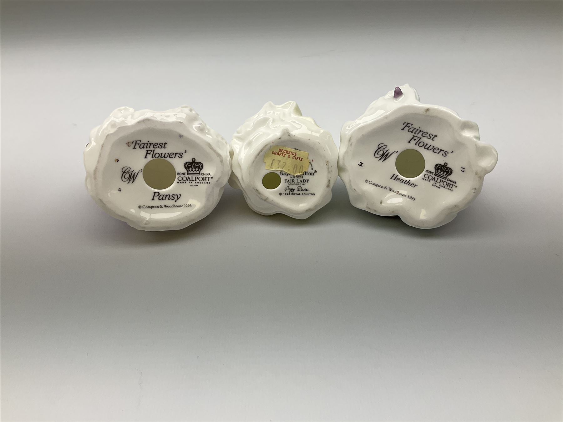 A group of figures, comprising four Royal Worcester examples, The Milkmaid, Lady Emma, Lady Cicely, Lady Hannah, three Royal Doulton examples, Top o' the Hill HN1849, Margaret HN2397, Fair Lady HN3216, two Coalport examples Fairest Flowers Heather, and Pansy, and a Wedgwood figure commissioned by Spink, The Imperial Banquet. 