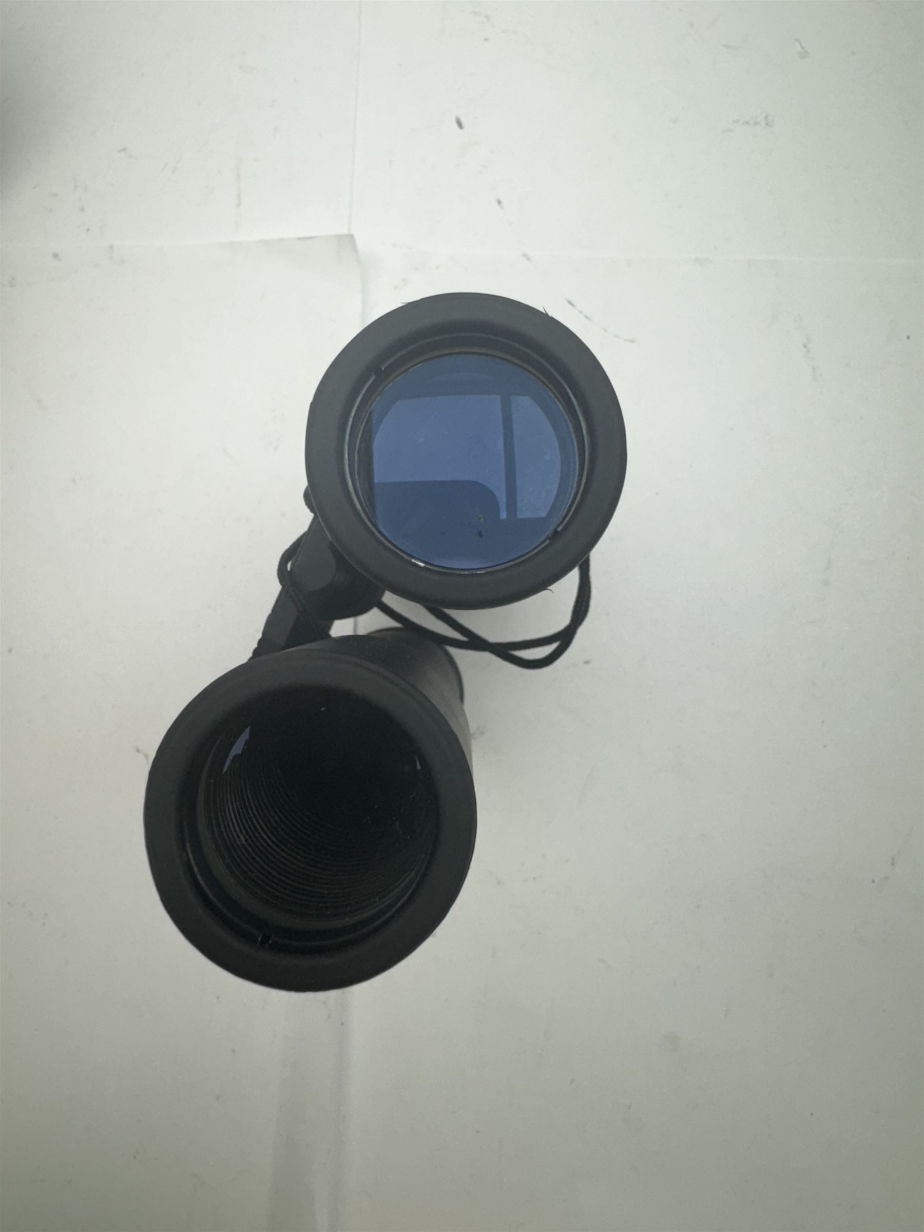 Four pairs of binoculars, to include Carl Zeiss Jena Jenoptem 8x30W serial no. 3750814, Nikon Sporting II 8x40 serial no. 604672, Minolta Pocket II 8x22 Field 7 and Jessops 12x25 Field 4.8 84m/1000m, all in carrying cases 