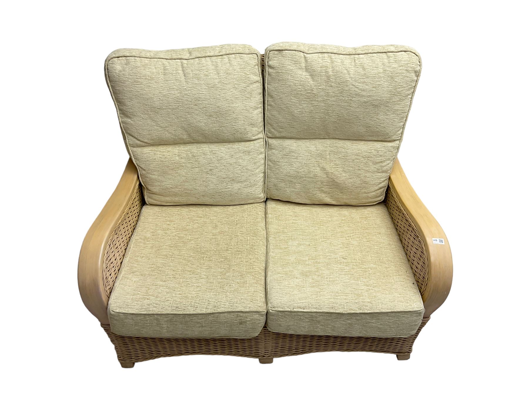 Contemporary rattan conservatory suite - two seat sofa with wicker frame and loose cushions upholstered in textured champagne fabric (W125cm H98cm); pair of matching armchairs (W72cm H98cm); rectangular glass-topped coffee table with rattan frame and undertier (W85cm D60cm H47cm); and matching square side table (W53cm H55cm)