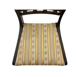 Set of eight Regency style mahogany dining chairs, brass inlay with gilded detail