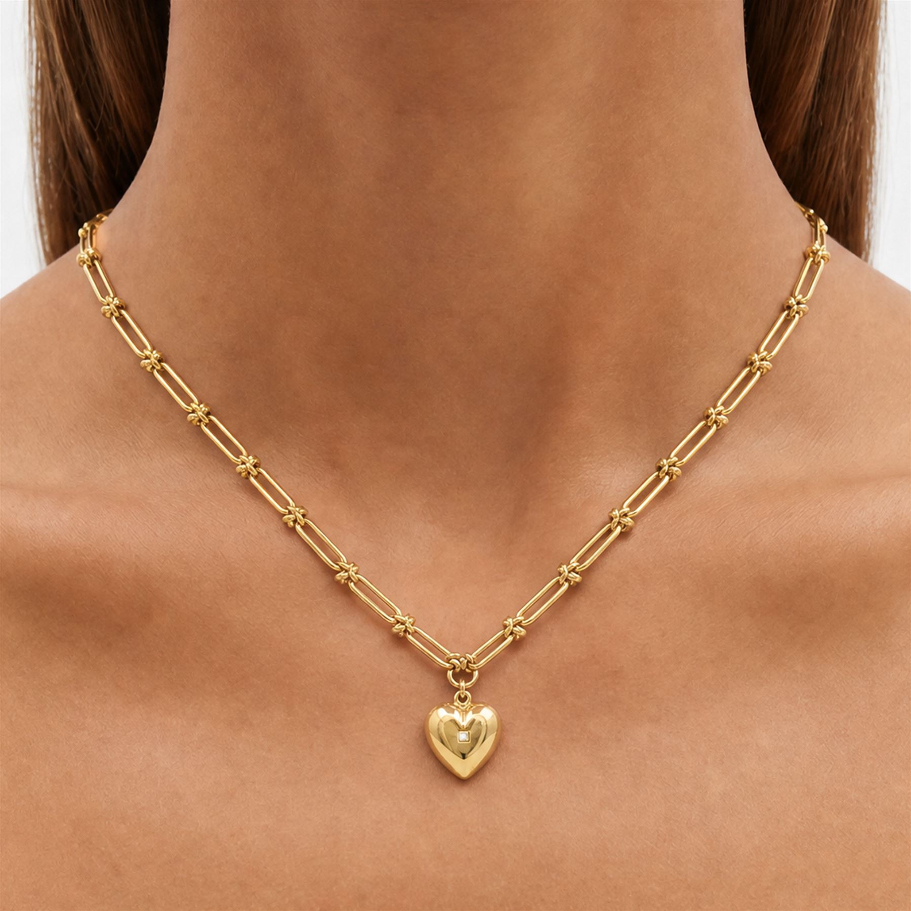 Victorian 18ct gold trombone link necklace, suspending a 15ct rose gold heart locket, set with a single old cut diamond