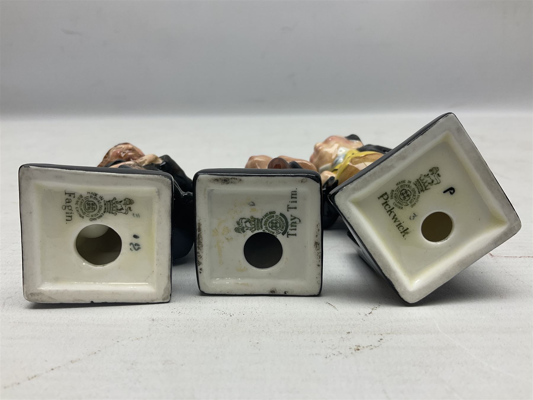 Sixteen Royal Doulton Charles Dickens figures, to include Oliver Twist, Fat Boy, Fagan, Stiggins etc, all with printed marks beneath