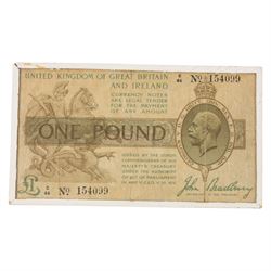 Two King George V Bradbury one pound notes, C46 154099 and P147 502441, in small glass frames
