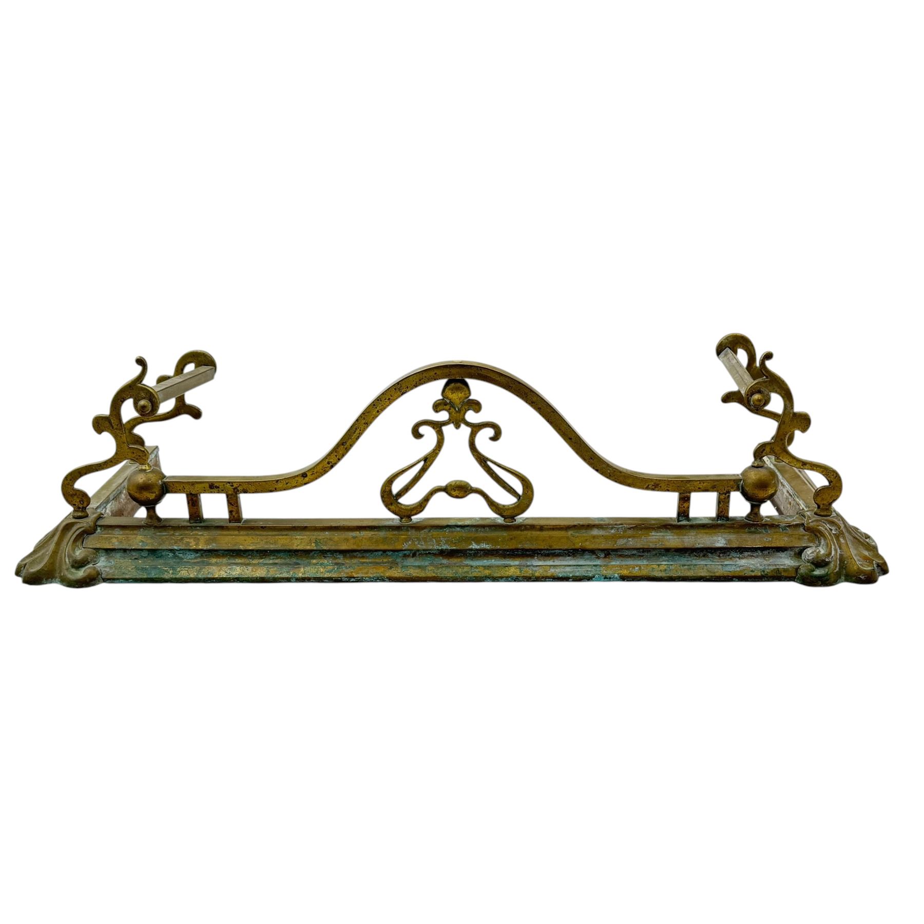 Three 20th century brass fenders, two with pierced Art & Crafts design rails, largest W156cm, D 45cm 