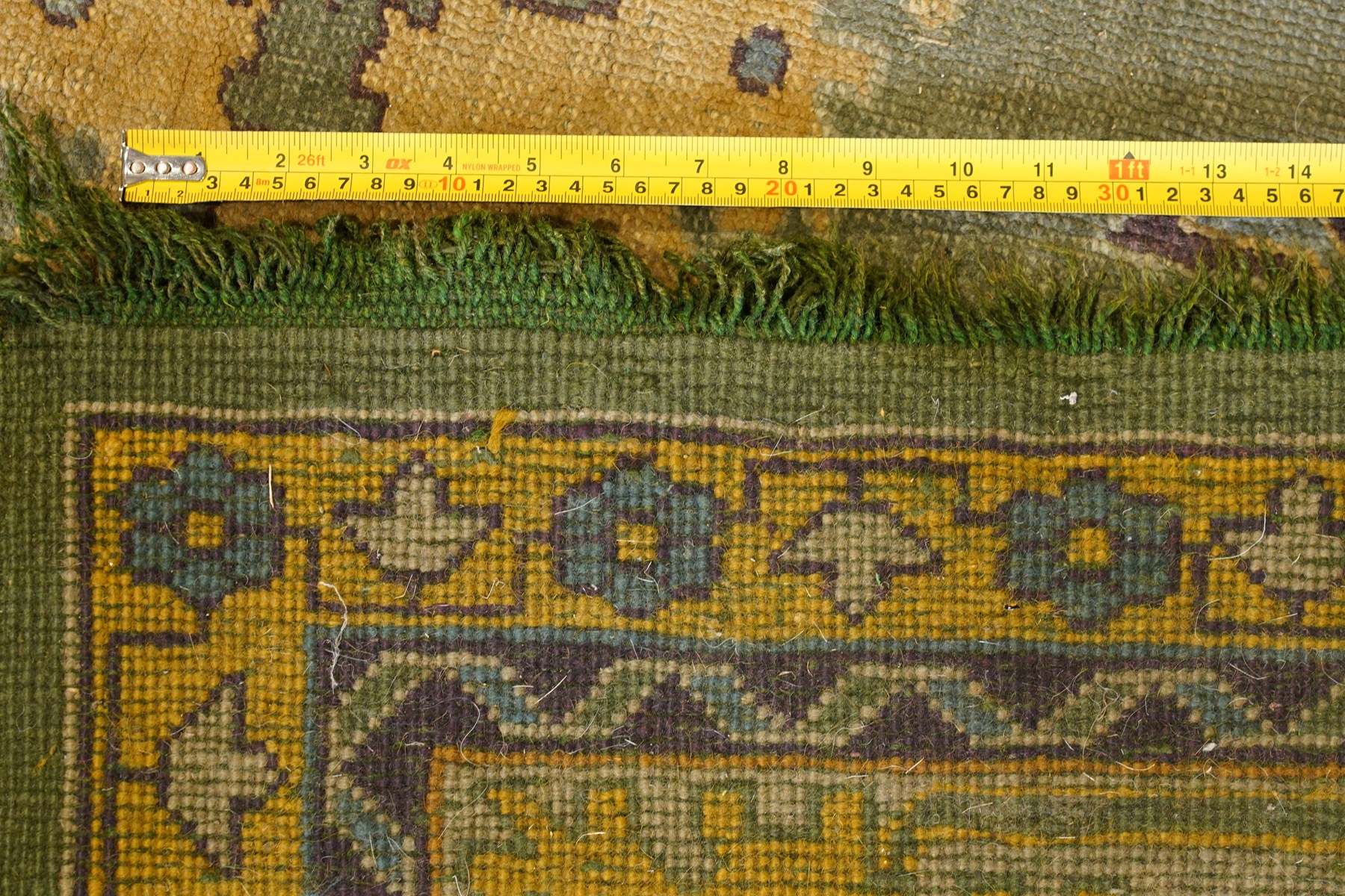 Lage Turkish Oushak green ground carpet, the field decorated with large stylised plant motifs and geometric design, the sage green guard band with further repeating foliate motifs