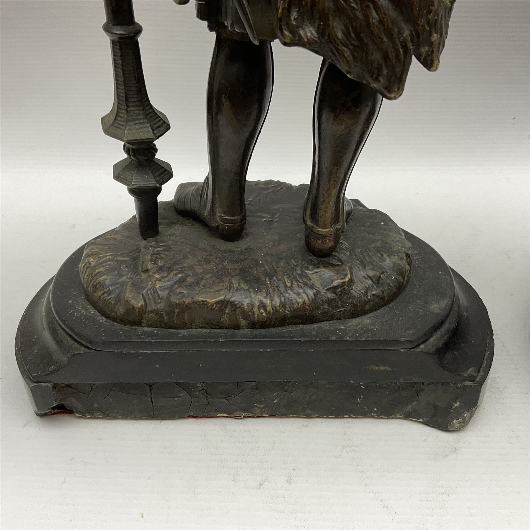 Pair of bronzed figure modelled as a hunter in traditional dress, each holding a pike, H48cm