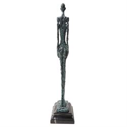 After Alberto Giacometti (Swiss 1901-1966): Femme Venise bronze upon a stepped marble base, overall H49cm