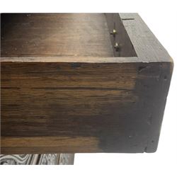 18th century heavily carved oak bureau, the fall front relief carved with three arches enclosing plants and flower head decoration, the interior fitted with pigeonholes, drawers and cupboard, four graduating cock-beaded drawers below, carved with lunettes and trailing foliage decoration, on bracket feet