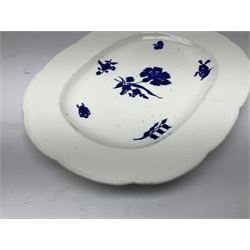 Three 19th century plates, comprising two circular examples and one oblong, each with osier moulded sides, the centres decorated in underglaze blue with Gillyflower type pattern, circular examples D25cm oblong example W27cm
