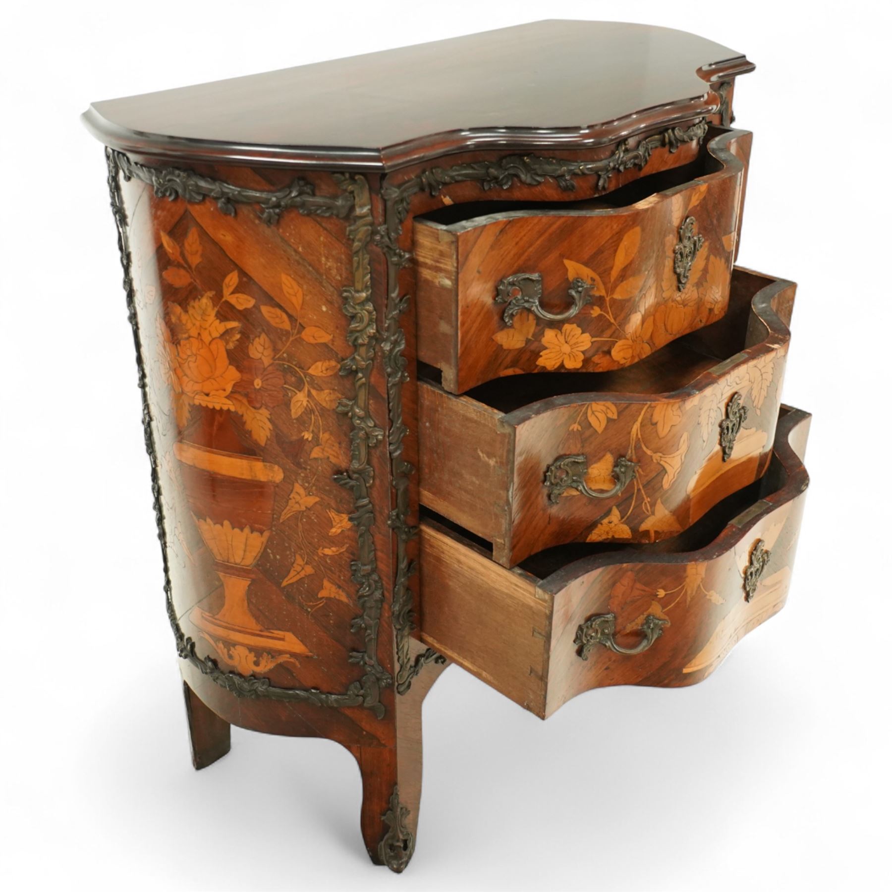 French Louis XV design serpentine fronted rosewood and fruitwood commode, the later shaped mahogany top over  three drawers, inlaid with a floral marquetry urn and flowers, within ormolu mounted borders, the sides inlaid with matching bouquet marquetry, raised on bracket feet