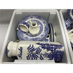 Collection of blue and white tea and dinner wares mainly in willow to include plates, cups and saucers, teapots etc, in three boxes 