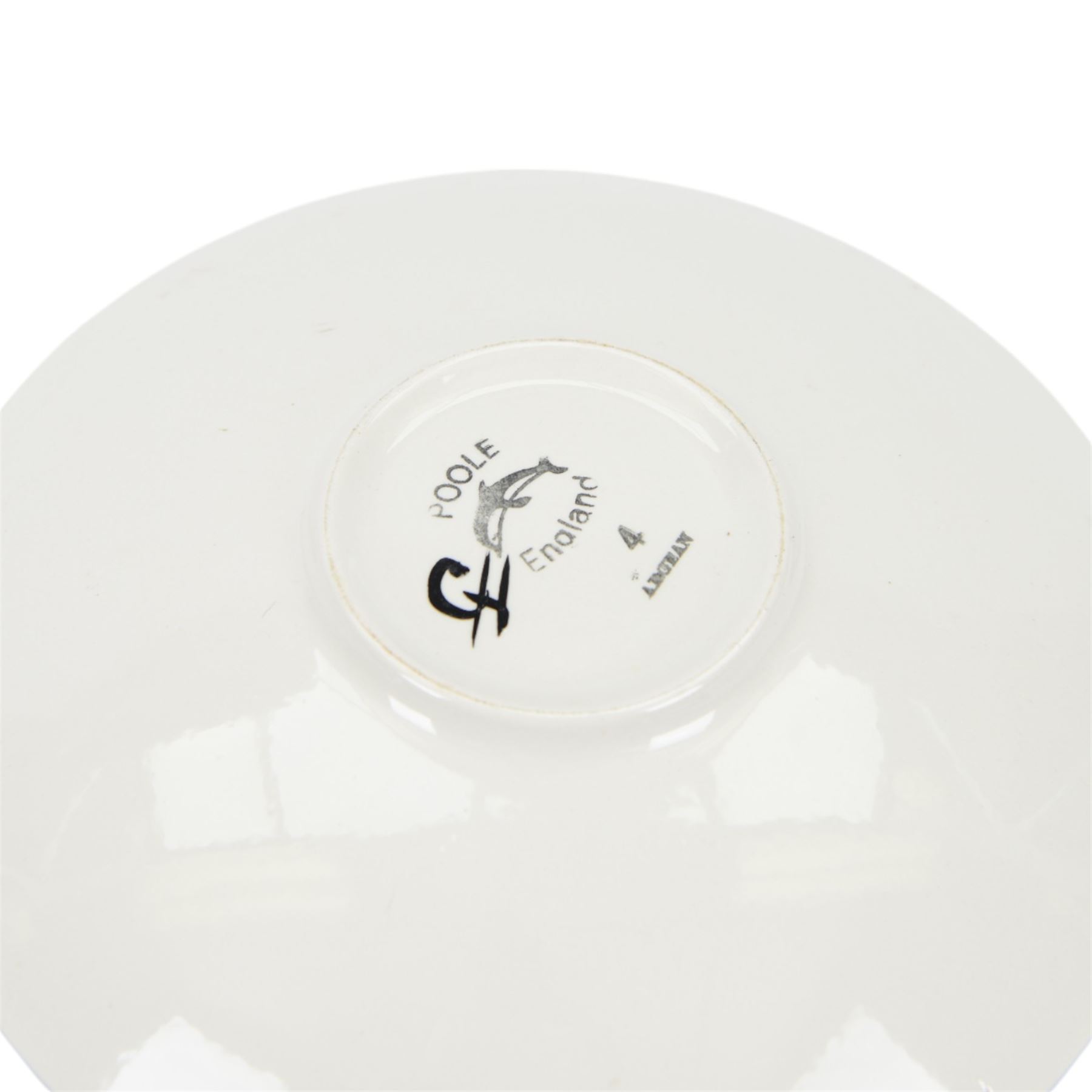 Three Poole pottery chargers, in Wild Poppy pattern, Delphis pattern and Aegean pattern, together with a Poole pottery dish and plate  