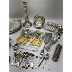A group of metal ware, largely silver plate, to include a silver mounted dressing table brush, assorted flatware including a small number with silver ferrules, candlestick, tray, etc. 