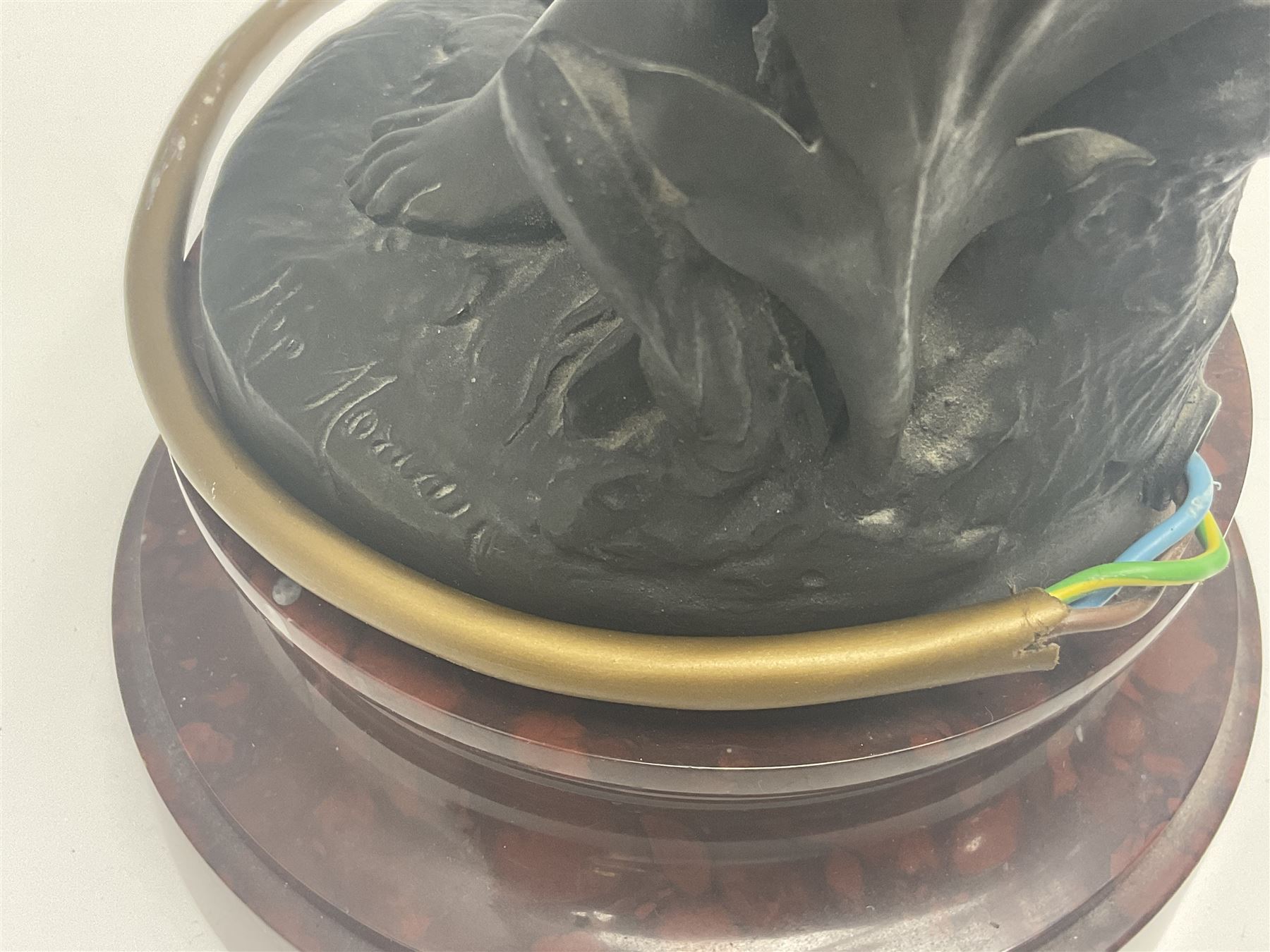 Pair of Art Nouveau style spelter figural table lamps, each mounted on rouge marble effect circular bases, with toleware flower heads and leafy decoration surrounding a female figure, H90cm