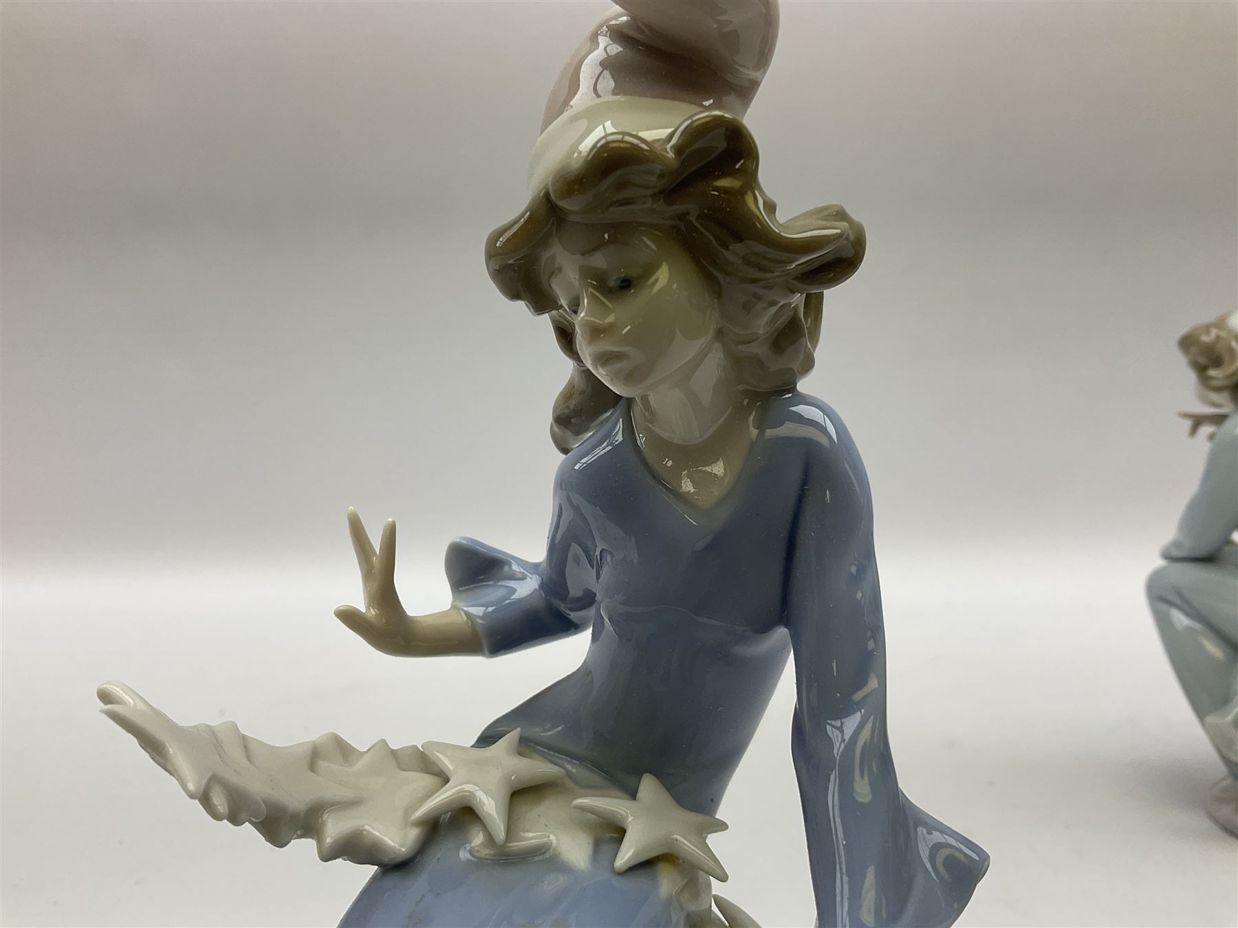 Lladro Star Bright Girl set, comprising Wishing on a Star no 1475, Starlight Starbright no 1476 and Stargazing  no 1477, all in original boxes, largest example H19cm