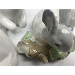 Four Lladro rabbit figures, comprising, Hippity Hop no 5886, Sitting Bunny no 5907, Washing up no 5887, and Rabbit Eating no 4773, largest example 14cm  