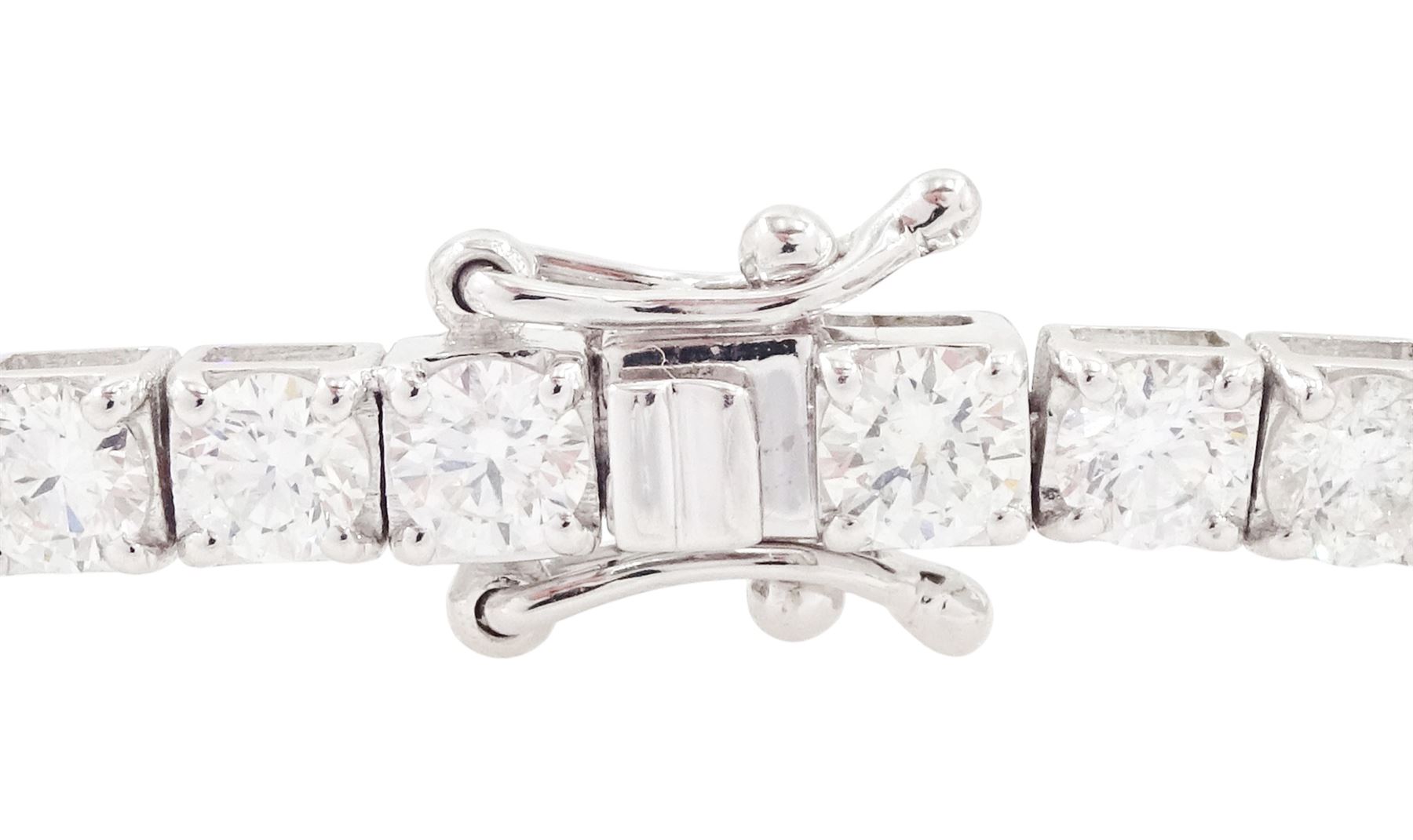 18ct white gold diamond bracelet, four claw set with fifty-one round brilliant cut diamonds, stamped 750, total diamond weight approx 6.35 carat