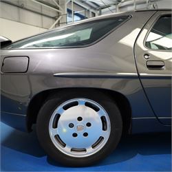 1991 Porsche 928 S4 Automatic Coupé

Registration: L644 LBE
Date of first registration as shown on V5: 1 July 1994
Porsche year of manufacture: 1991
Engine: 5.0-litre V8 petrol
Transmission: Automatic
Odometer reading: 37,886 kilometres (approximately 23,541 miles)
Colour: Slate Grey metallic
Interior: Black leather
V5C: Present
Keys: One
Chassis number: WP0ZZZ92ZMS800460

An exceptional Porsche 928 S4 Automatic Coupé finished in Slate Grey metallic with a black leather interior. The car displays a notably low odometer reading of just 37,886 kilometres, equivalent to approximately 23,541 miles.

The 928 S4 combined Porsche’s powerful 5.0-litre V8 engine with a sophisticated rear-mounted transaxle, creating a refined and accomplished grand tourer. This example is equipped with automatic transmission, electrically adjustable front seats, air conditioning, alloy wheels and the characteristic rear spoiler.

The car was purchased from Specialist Cars of Malton in June 2019, at which time the recorded mileage was 36,650 kilometres. The accompanying service record includes evidence of a cam belt replacement.

Presented in excellent condition throughout, the bodywork and metallic paint finish appear particularly well preserved, while the cabin retains its original character with black leather upholstery and 928-branded sill trims. A Japanese Porsche service label records maintenance entries at 31,902, 33,397 and 34,134 kilometres.

The car also features a Porsche Classic Communications Management (PCCM) upgrade system.

Features

• 5.0-litre V8 petrol engine
• Automatic transmission
• Slate Grey metallic paintwork
• Black leather interior
• Electrically adjustable front seats
• Air conditioning
• Porsche alloy wheels
• Rear spoiler
• Right-hand drive
• Odometer reading of 37,886 kilometres, approximately 23,541 miles
• Purchased from Specialist Cars of Malton in June 2019
• Recorded at 36,650 kilometres when purchased
• Service record showing cam belt replacement
• Japanese Porsche service label
• V5C present
• One key

This vehicle forms part of the Estate of the Late John Sils and is offered for sale by the Executors, confirming a genuine reason for sale.