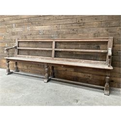 Victorian pitch pine bench pew, turned arms and legs, rail back with plank seat, 249cm