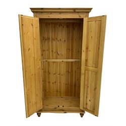 Solid pine double wardrobe, fitted with panelled and mirrored door