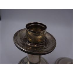 Pair of modern American silver mounted candlesticks, of plain cylindrical form, with removable drip pan, upon weighted spreading circular foot, stamped Sterling, H12.5cm
