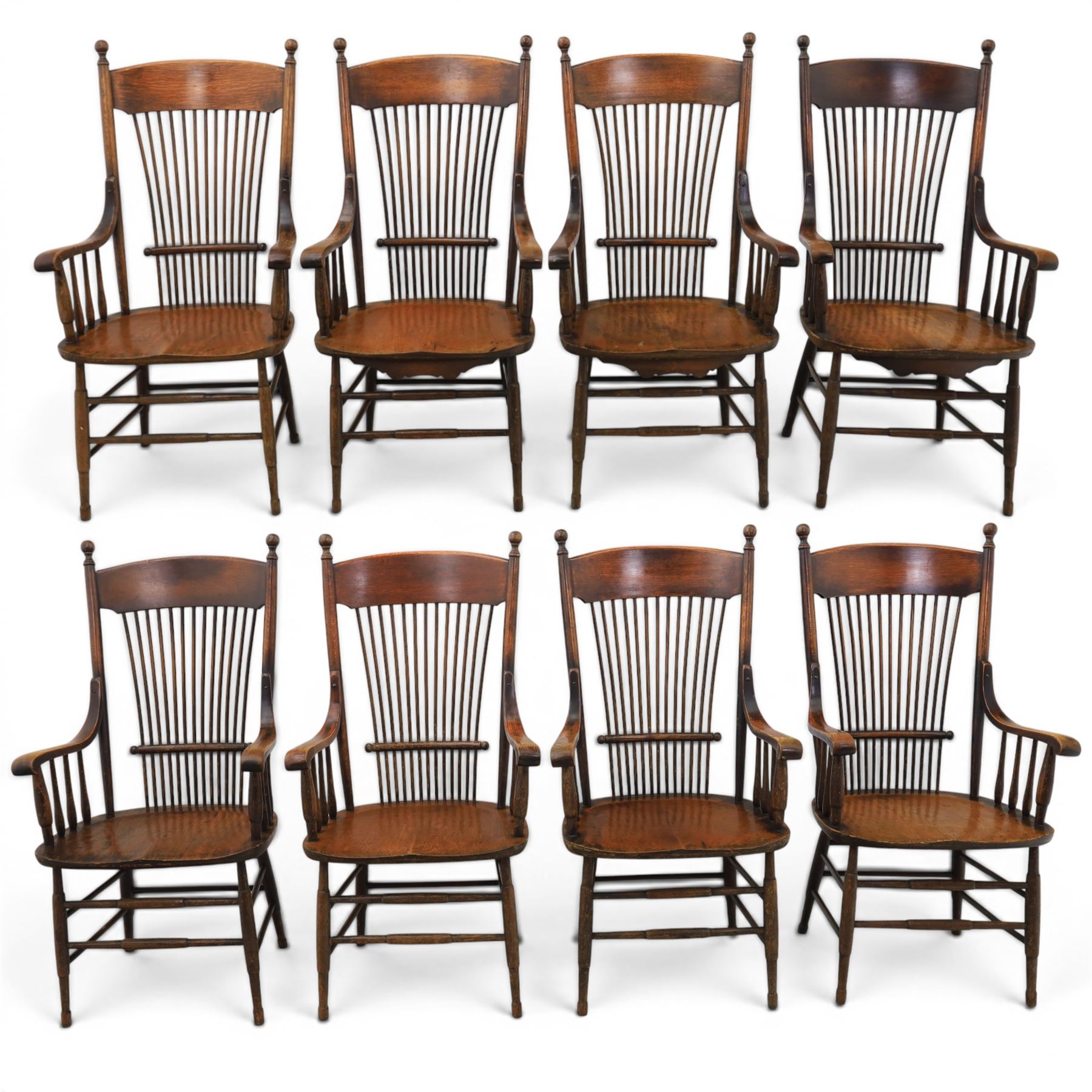 Set of eight 19th century ash and elm spindle back Windsor armchairs, arched top rails above fan-shaped spindle backs, curved arms with turned supports, shaped saddle seats, on turned legs joined by H-stretchers