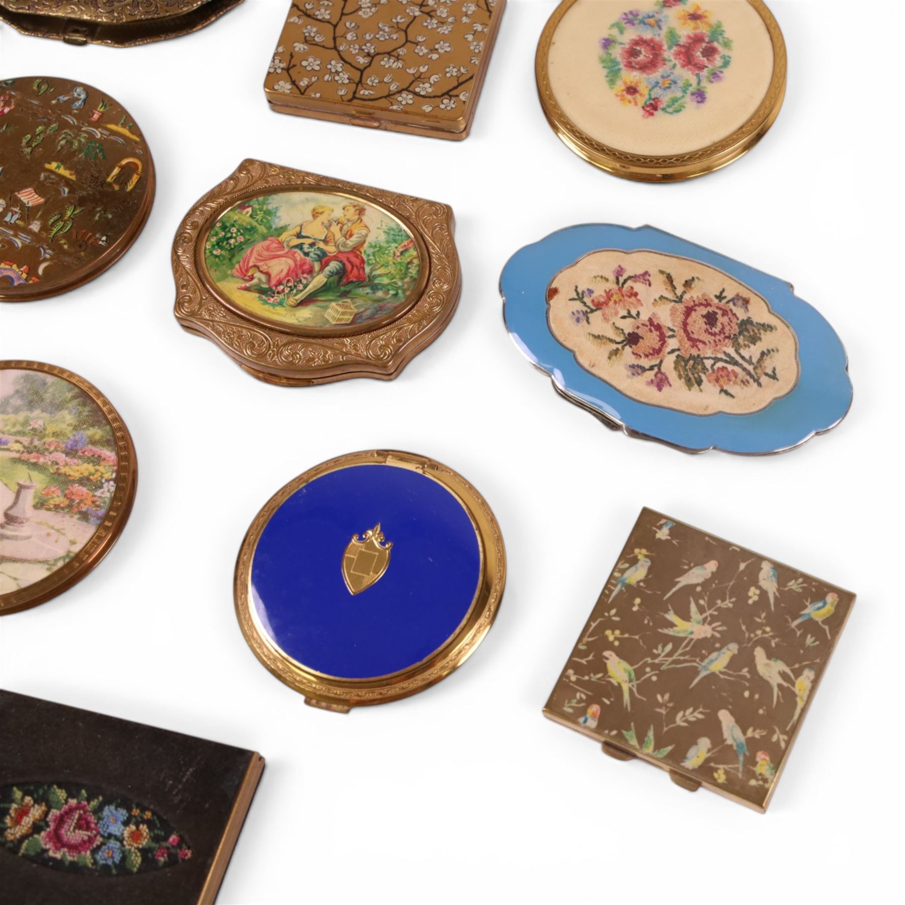 Thirteen powder compacts, including floral, Stratton and Vogue, 