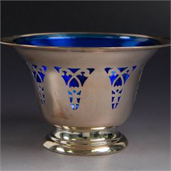 American silver sugar bowl, of circular form with fluted rim and fluted sides, upon stepped circular foot, stamped Sterling by Roden, with blue glass liner