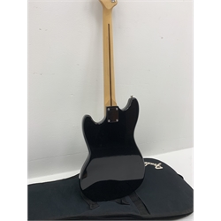  Fender Squier Bronco Affinity Series electric bass guitar, in black and white, serial no. IC021107489, L108cm, in associated Squier soft carrying case. From the collection of the late John Burgess of Beverley who played in the bands Penjants, Wine, Strollers, Revox, Sound Foundation, Pickle Belly Alley, Ragamuffins and Jerryattricks.