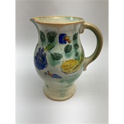 Early 20th century Royal Doulton Brangwyn Ware jug and set of six beakers, designed by Frank Brangwyn RA, all decorated in the Harvest pattern with stylised leaves and fruit on mottled peach and green ground, all with printed marks beneath, date code for 1920s, largest H18cm