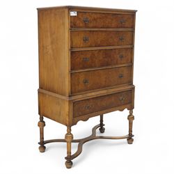Georgian style walnut chest on stand, the figured top section fitted with four long drawer...