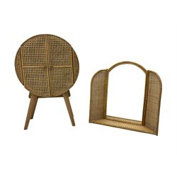 Circular cane cabinet enclosed by two doors, on splayed supports (W53cm, H80cm, D28cm), and a cane work wall hanging mirror