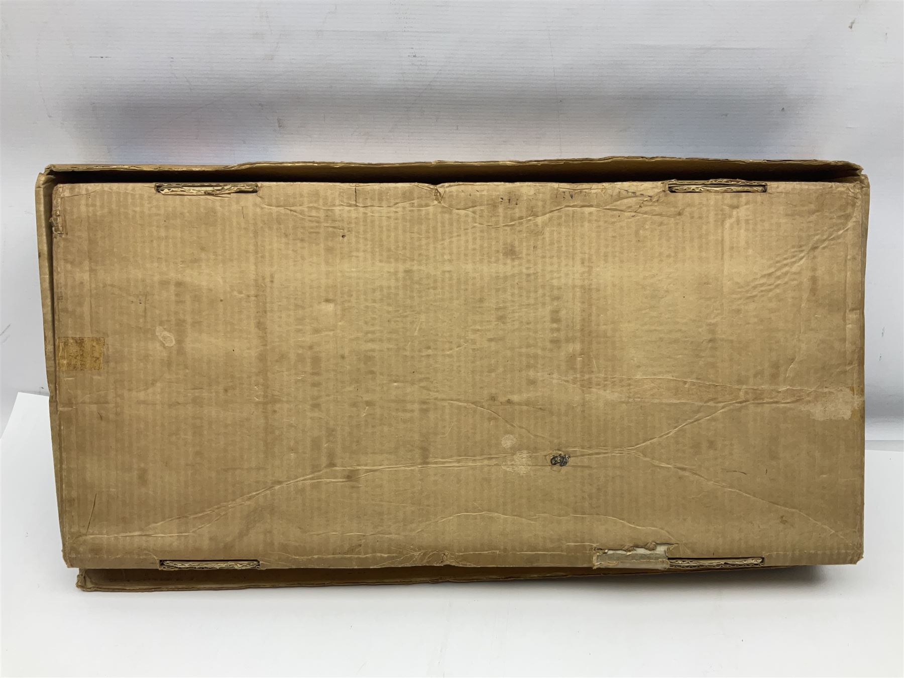 Late 1950s/early 1960s Mettoy tin-plate Emergency Ward 10 hospital set from the TV series, including over twenty figures, over sixty pieces of hospital equipment, beds, chairs, lockers, theatre fittings, stretchers etc; building is complete with movable transparent partitions, operating lift with sliding lift shaft doors and opening windows; wards with fitted swing doors; tin-plate walls with lithographed detail in yellow with red and white tiled effect, cobbled base with ambulance casualties area and lift access; boxed with instructions