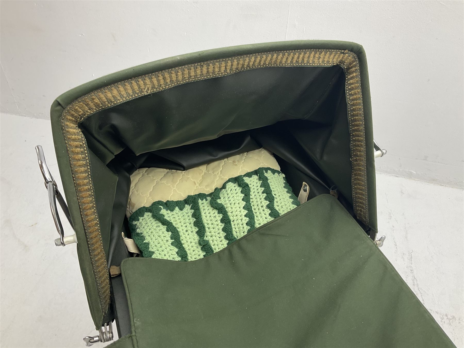 Silver Cross coach-built doll's pram with green fold-down hood and cover, sprung tubular frame, chrome and white handle, four spoked wheels with brake, mattress, pillow and bedding L97cm