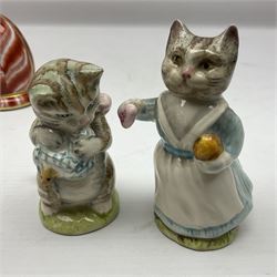 Two Royal Crown Derby paperweights,  Seated cat and sleeping cat, both with gold stoppers, together with two Beswick Beatrix Potter cats